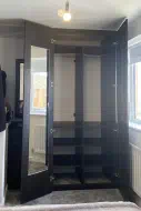 Dark Brown Eucalyptus fitted wardrobe and drawers with a matching wall mirror (doors open), fitted in middlesbrough